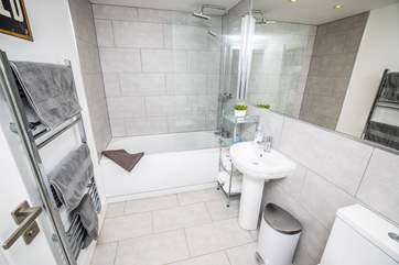 The generous family bathroom offers both under-floor heating and a handy heated towel rail.