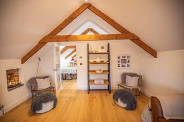 The sitting-room is modern and contemporary, offering a room for chatting, relaxing or TV viewing.