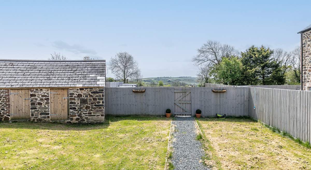 The well-sized garden offers a great place for the kids to play.