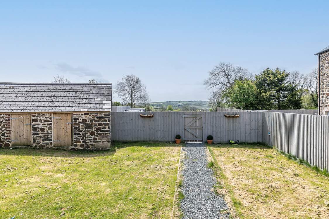 The well-sized garden offers a great place for the kids to play.