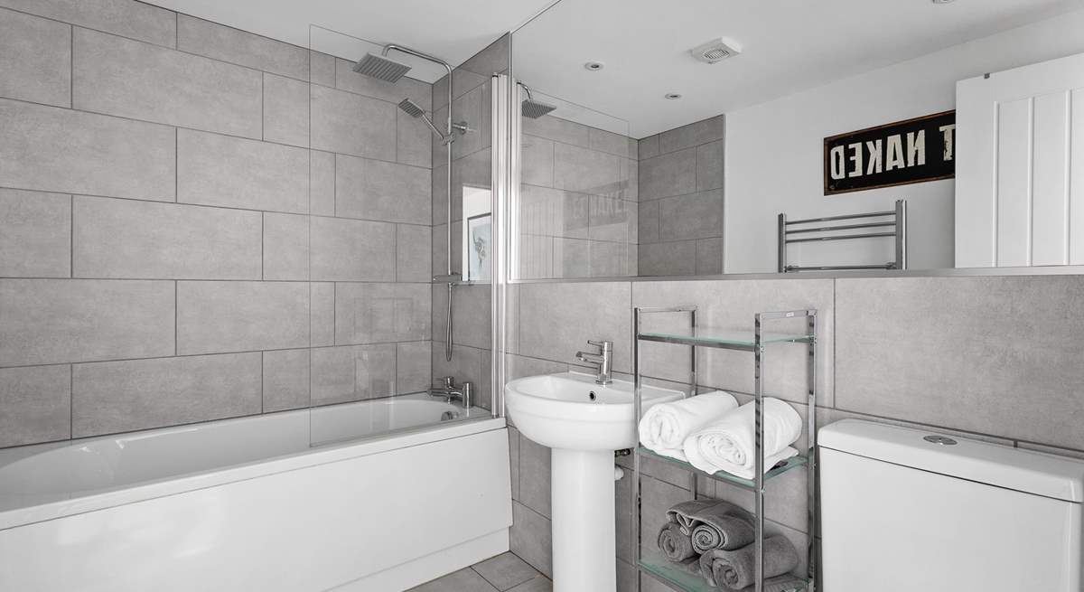 The generous family bathroom offers both under-floor heating and a handy heated towel rail.