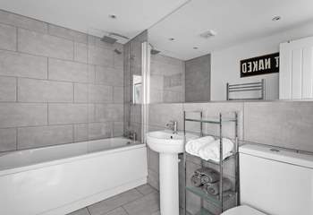The generous family bathroom offers both under-floor heating and a handy heated towel rail.
