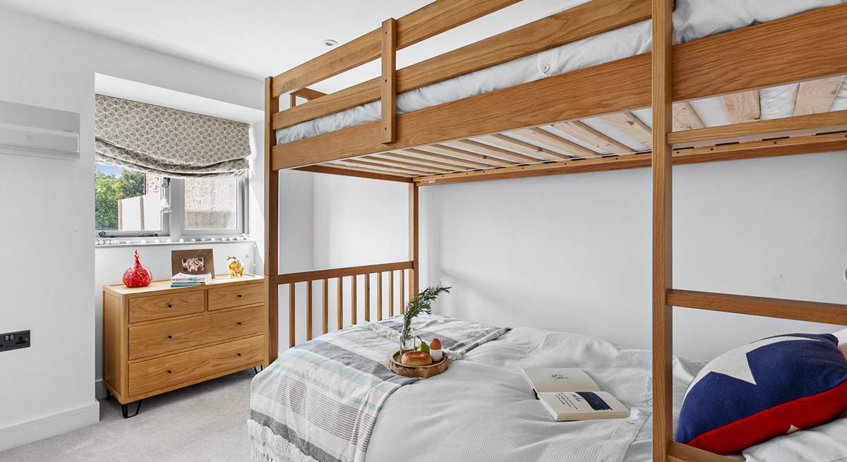 The bunk bedroom has three-foot beds with individual reading lights and views over the garden. Please note the top bunk has limited headroom.