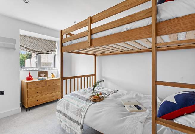 The bunk bedroom has three-foot beds with individual reading lights and views over the garden. Please note the top bunk has limited headroom.