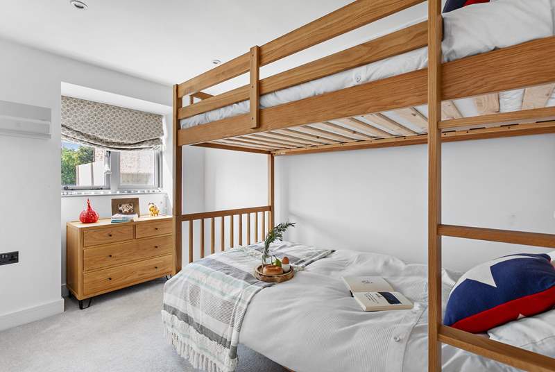 The bunk bedroom has three-foot beds with individual reading lights and views over the garden. Please note the top bunk has limited headroom.