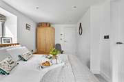 The double bedroom benefits from dual-aspect windows which allow the room to flood with light.