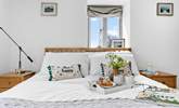 Enjoy an early breakfast in the inviting double bed. - Thumbnail Image