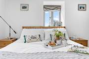 Enjoy an early breakfast in the inviting double bed.