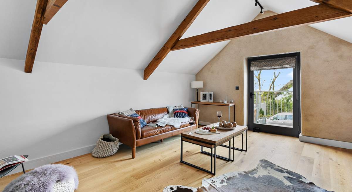 The sitting room is brilliantly illuminated by natural light. 