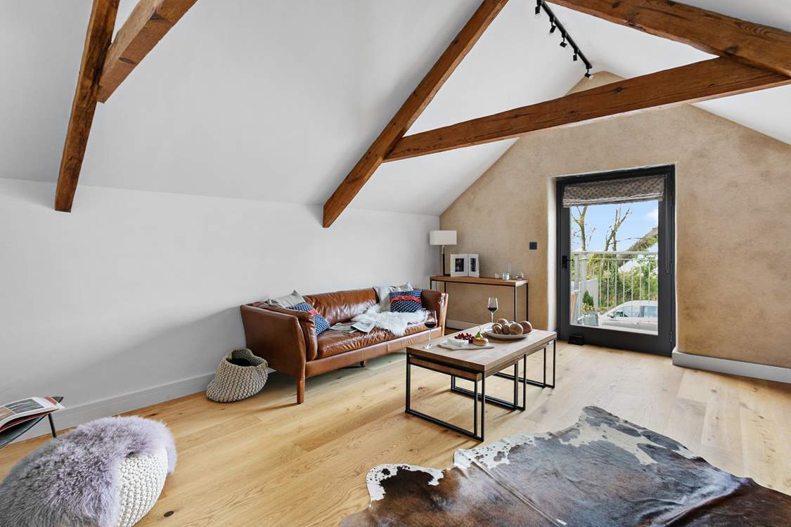 The sitting-room is brilliantly illuminated by natural light.