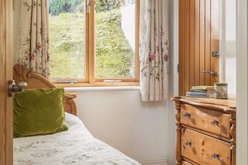 Pretty bedroom number two overlooks the garden.