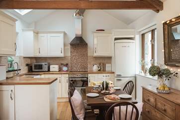 The open plan living room with kitchen and dining area.