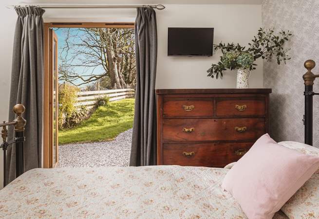 The main bedroom is located on the ground floor, and overlooks the garden. 
