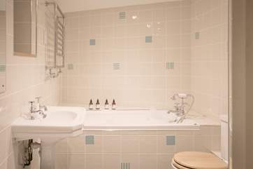Run a deep bath and soak away the sand and sea salt.