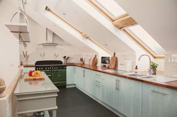 The gorgeous kitchen is very well-equipped.