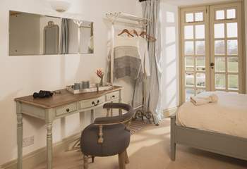 Bedroom 2 has twin beds and is an oasis of calm in creams and greys. Whilst the doors do not open, opening the little windows at the top of the doors will let in the fresh air.