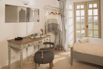 Bedroom 2 has twin beds and is an oasis of calm in creams and greys.