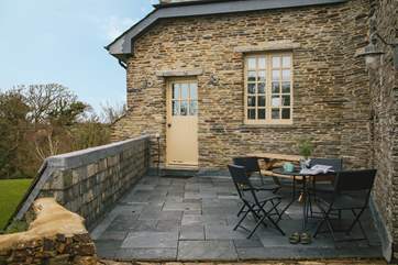 Arrive and enter through this main entrance of Carthew Barn, also the perfect spot for a morning coffee listening to the bird song.