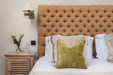 Squishy pillows and lovely linens await you.