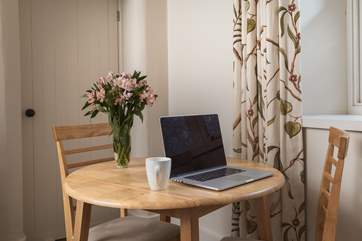 If you have to keep in contact with the outside world, then the table doubles up as a handy work station.