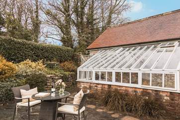 The conservatory belongs to the owner who lives below The Creamery. She may occasionally need to pop in to check on the plants.