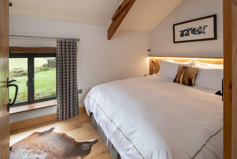 Bedroom 2 is equally as gorgeous, offering stunning countryside views.