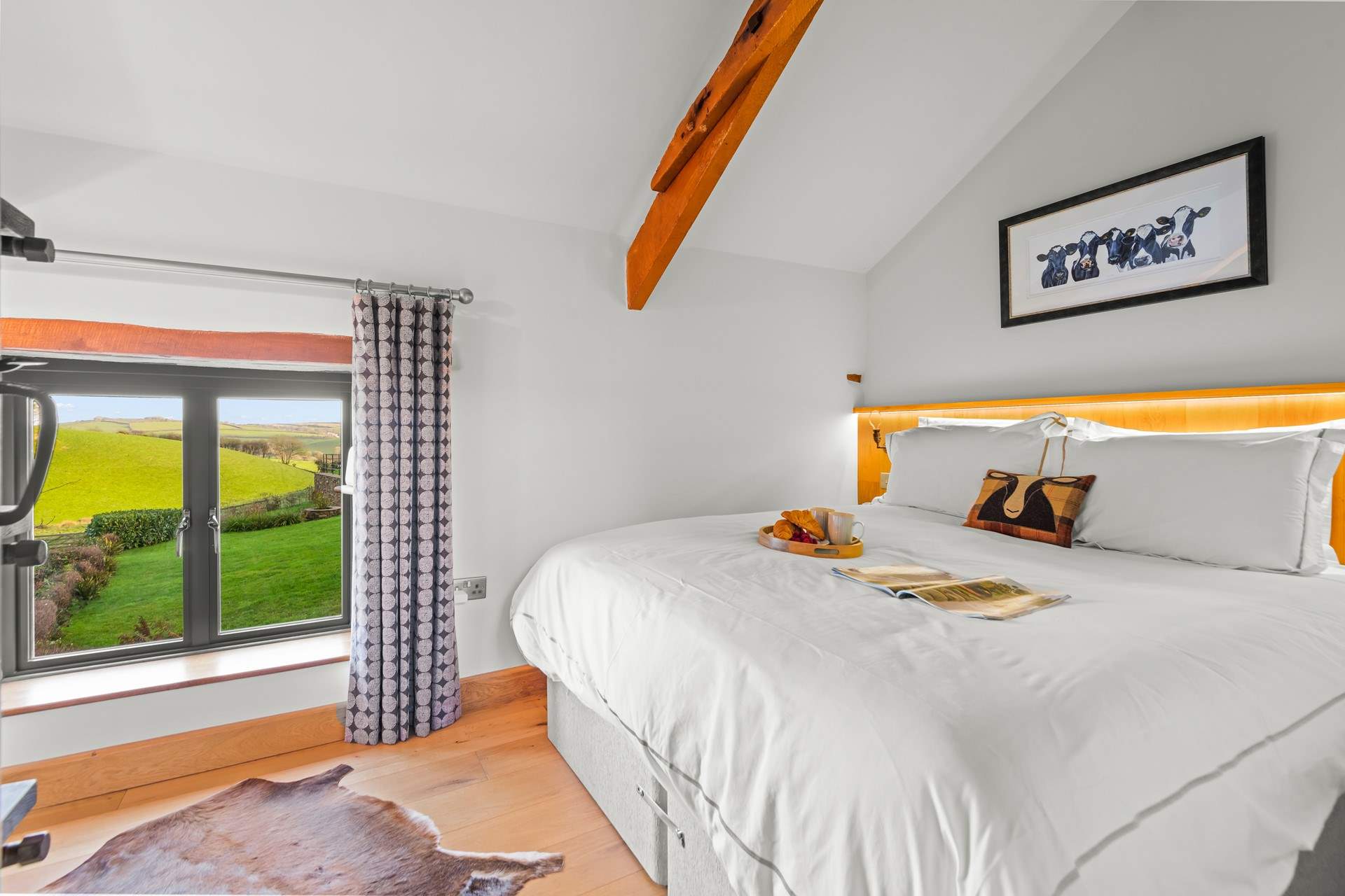 Bedroom 2 is equally as gorgeous, offering stunning countryside views.