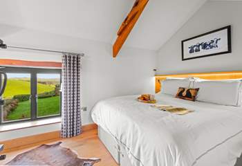 Bedroom 2 is equally as gorgeous, offering stunning countryside views.