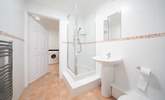 The ground floor offers a shower-room leading into the utility-room, ideal after spending a day at the beach. - Thumbnail Image