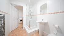 The ground floor offers a shower-room leading into the utility-room, ideal after spending a day at the beach.