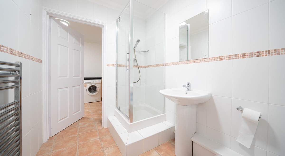 The ground floor offers a shower-room leading into the utility-room, ideal after spending a day at the beach.