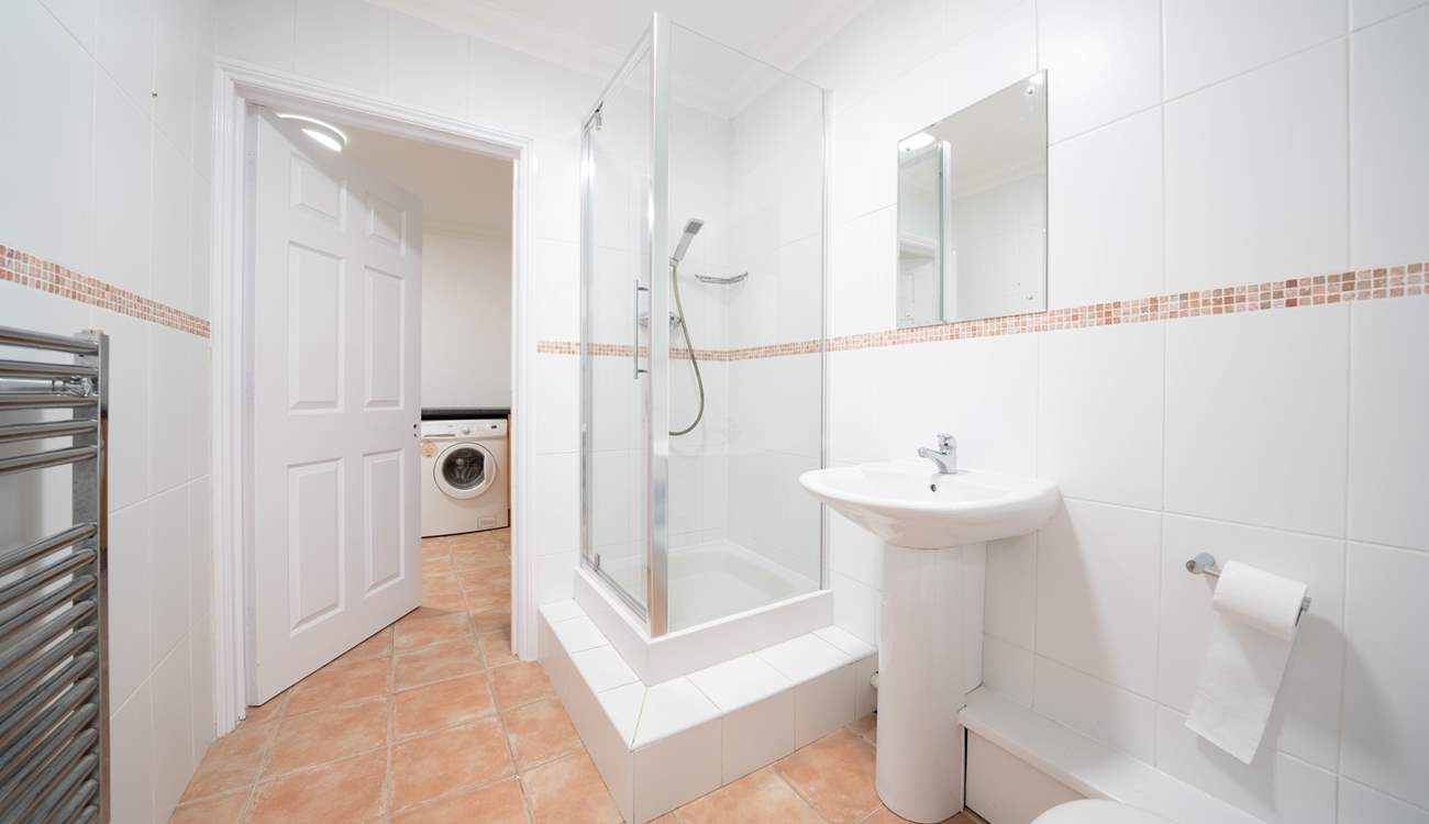 The ground floor offers a shower-room leading into the utility-room, ideal after spending a day at the beach.