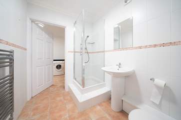 The ground floor offers a shower-room leading into the utility-room, ideal after spending a day at the beach.