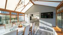 The spacious kitchen/diner, overlooking the garden, is a real sun-trap. Please note this room now has white trims around the windows.