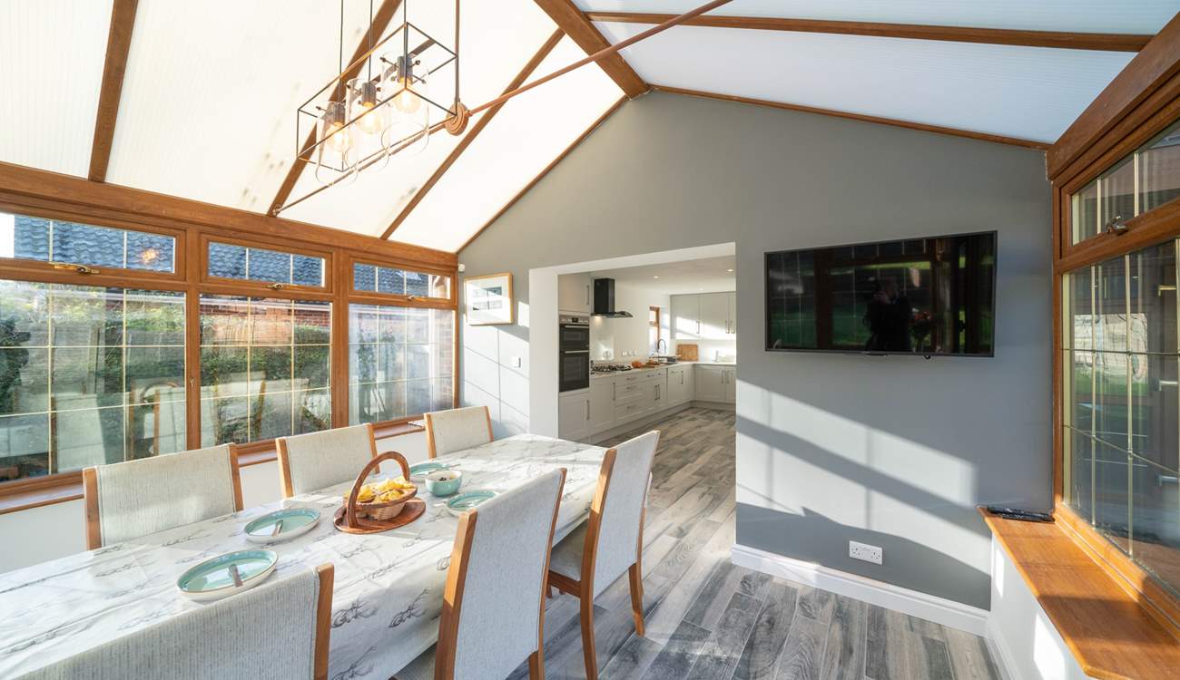 The spacious kitchen/diner, overlooking the garden, is a real sun-trap. Please note this room now has white trims around the windows.