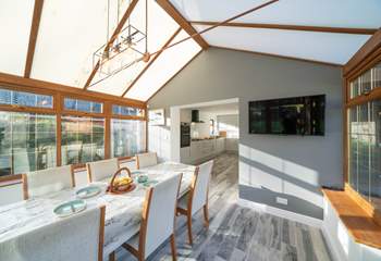 The spacious kitchen/diner, overlooking the garden, is a real sun-trap. Please note the conservatory now has white trims.