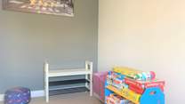 The play-room on the ground floor. Please note, from May 2025 there are now bunk-beds in this room.