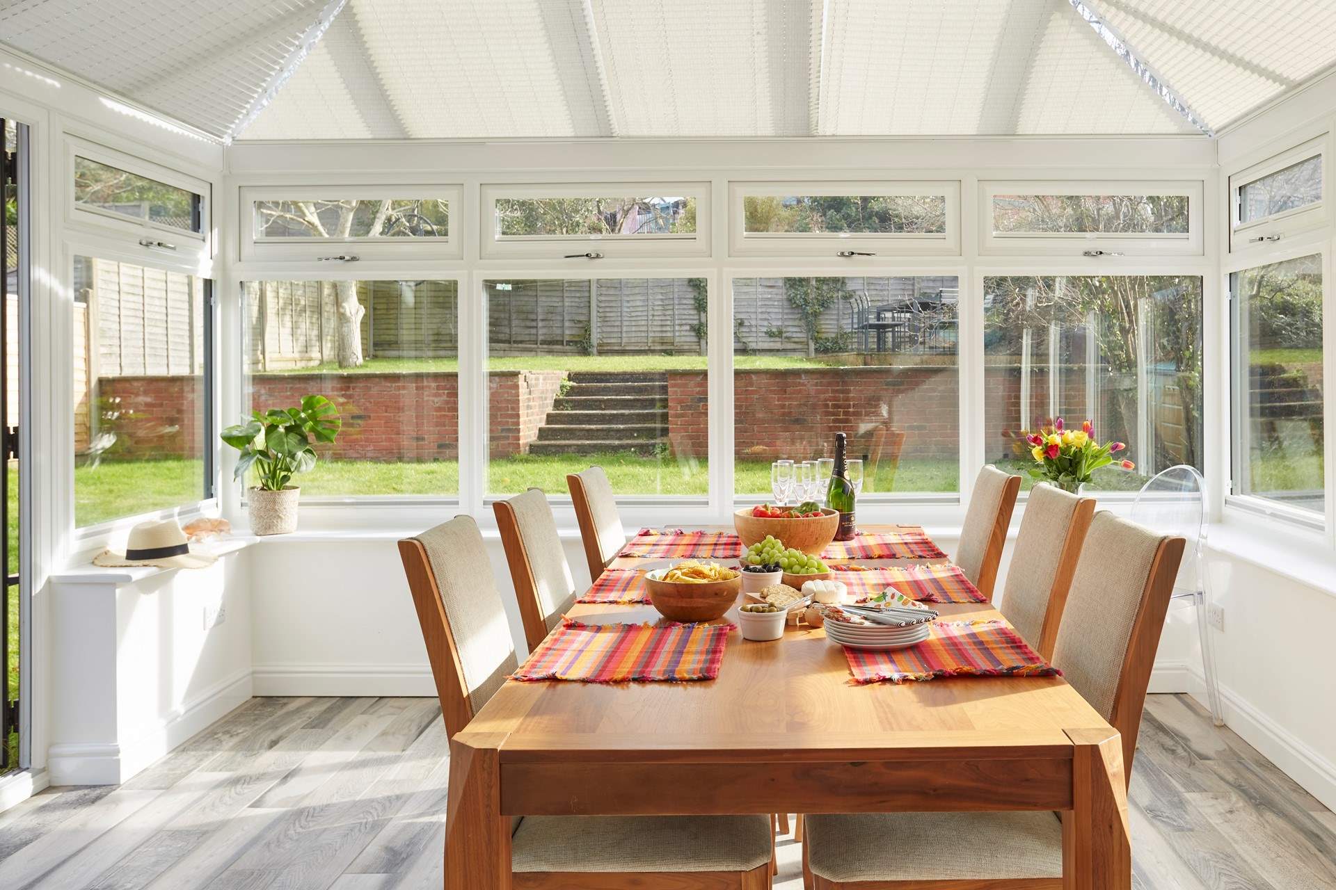 Gather round the dining-room table and enjoy lingering lunches or sunny suppers washed down with a crisp glass of fizz.