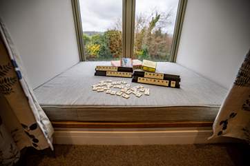 This wonderful window seat in the twin room offers a place to sit and relax.