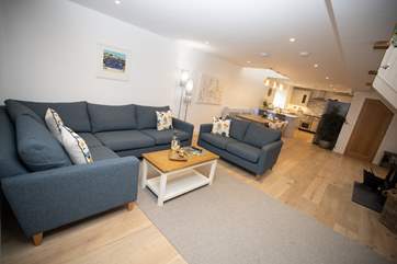 The open plan living-room, a space that works for all the family. Light the wood-burner to add a warm glow, no matter the time of day.