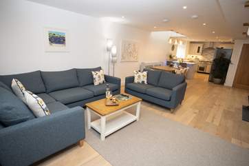 The open plan living-room, a space that works for all the family. Light the wood-burner to add a warm glow, no matter the time of day.