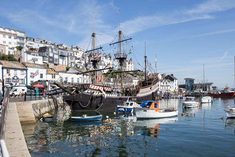 The Golden Hind stands proud, bobbing on the waters within the beautiful harbour.