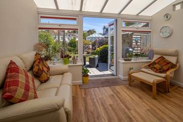 The conservatory is a great place to enjoy the great outdoors from a comfy seating area
