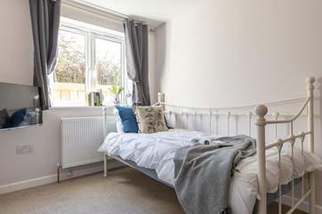 The single bedroom on the ground floor can also be used as a snug for the teenagers, there's a handy desk in here too.