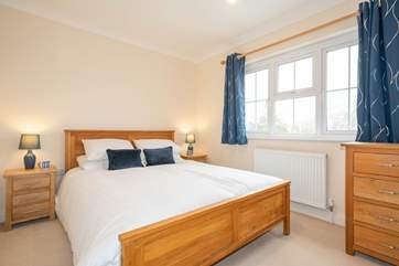 The cosy second bedroom on the first floor overlooks the garden.