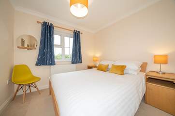 The third bedroom on the first floor has views across the garden.