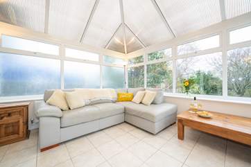 Keep an eye on the younger ones playing in the garden whilst sat relaxing in the conservatory with a glass of your choice in hand.