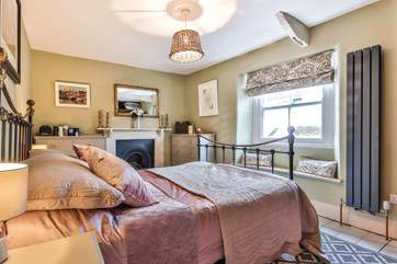 The main bedroom sits to the front of the house and offers a luxurious place to recharge and relax.
