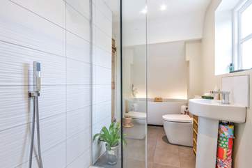 The main bathroom is both sleek and modern, sitting to the back of the house you have views of the fields that surround this wonderful village.