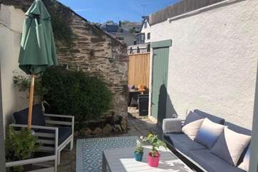 Enjoy this wonderful sun-trap whilst relaxing under blue summer skies. This furniture is due to be changed and will be a lovely new L-shape sofa to maximise the patio-area.